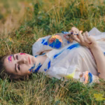 stained-paint-woman-lying-ground-viewed-from_1157-2322